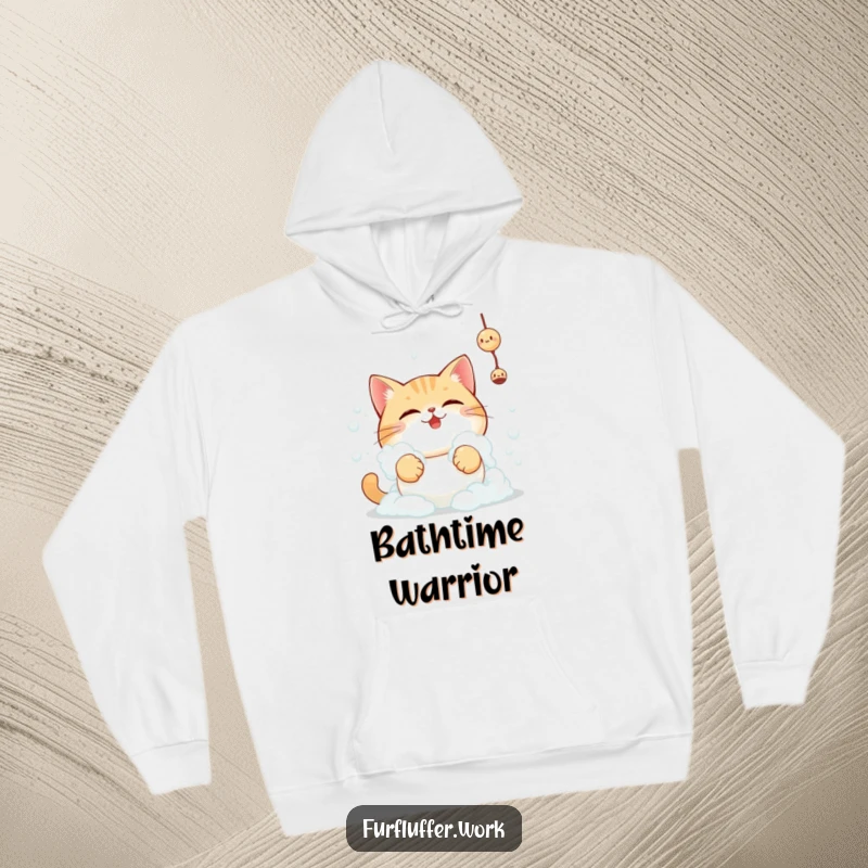 Funny determined cat covered in bath foam reaching for a toy, featured on a cozy and humorous hoodie.